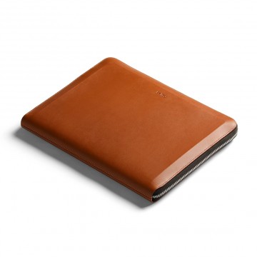 Tech Folio:  This leather zip folio elegantly organizes your laptop, phone, cables and other important daily work tools in one...