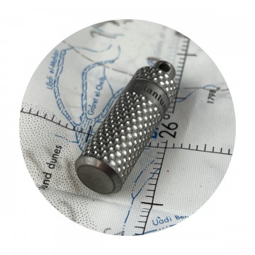Piccolo Titanium Vault:  Titanium Piccolo is a compact storage container. It features a non-slip golf ball dimple pattern on the outside....
